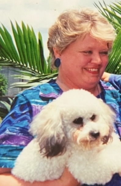 Original family photograph of a woman holding her small white dog
